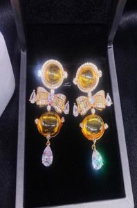 Dangle Chandelier Personalidad femenina Diamante Amarillo Bowknot Big Drop Pendientes Circón Pendimiento de cristal translúcido para mujeres niña 3908800