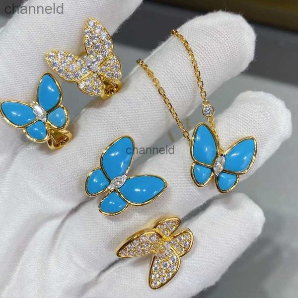 Cuelga la lámpara vendedora caliente de oro mariposa turquesa collar anillo aretes conjunto marca de moda europea luz superior joyería de lujo HKD230822