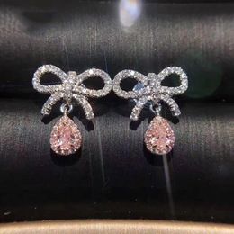 Boucles d'oreilles pendantes de luxe pour femmes, lustre, nœud Girly, goutte d'eau, zircone rose, couleur argent, bijoux de mode de mariage, vente en gros