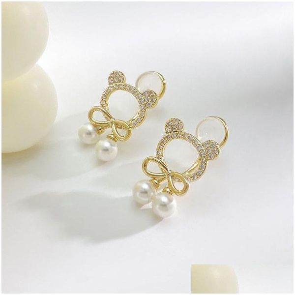 En pendaison de lustre de la nouvelle mode Unique Design Hollow Migne Bourse Elegant Delate Bow Pearl 14K Boucles d'oreilles en or jaune Ladies High Jew Dhcfh