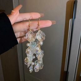 Boucles d'oreilles de franges de coque perle de lustre en peille