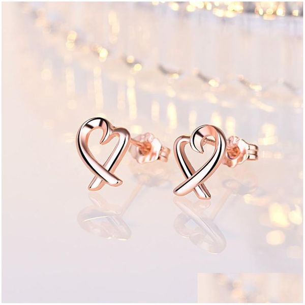 Dangle Lustre Simple Conception Sier Couleur Coeur Creux Boucles D'oreilles Pour Les Femmes Nouvelle Marque De Mode Oreille Manchette Piercing Goutte Boucle D'oreille Cadeau D Dhjgz