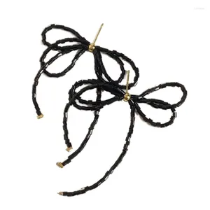 Boucles d'oreilles pendantes élégantes avec nœud papillon perlé et glands pendants
