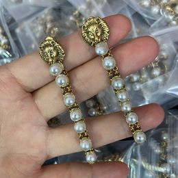 Balancent tête de lion perle boule gland boucles d'oreilles cristal oreille goujons longue boucle d'oreille balance femme mode boucle d'oreille bijoux simples cadeau CGUE5 --09