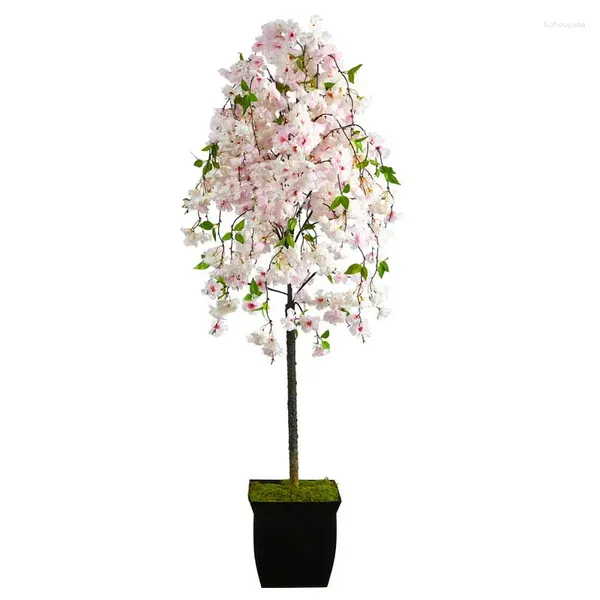 Arbre artificiel de fleurs décoratives dans une jardinière en métal noir