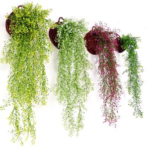 Decoratieve bloemen kransen kunstmatige klimop blad groen gras gras planten planten home kerstbasis achtergrond muur decoratie hangen 60 ° C