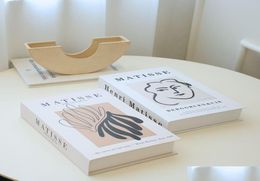 Objets décoratifs Figurines Luxury Table Book Book Boîte de rangement Faux modernes pour la décoration EdiblesGummies DHSZT2304738
