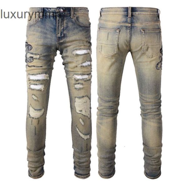 Denim Amiryes Jeans Pantalones de diseñador Hombre Jean Autónomo Marca de moda Sucio Amarillo Hecho Viejo Serpiente Bordado Agujero Parche Slim Fit Small Foot High Street Masculino Z0H3