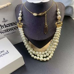 Desginer Viviane Weswoods bijoux version haute impératrice douairière Xis trois couches broche perle pull chaîne femme lumière luxe éloge perle pull chaîne trois couches
