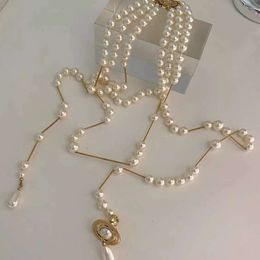 Desginer Viviene Westwoods Empress Dowager Vivian Anne's Broken Pearl Collier Saturn à pampilles multicouches pour femme Chaîne de pull asymétrique en perles de haute qualité