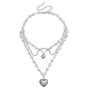 Ontwerp sieraden Niche met dubbele laag High Gloss Imitatie Pearl Tassel Hartvlinder Cross ketting veelzijdig voor vrouwen
