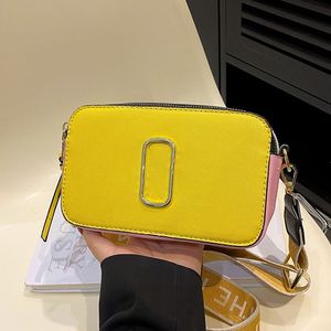 Diseñador 2023 Bolso de hombro de moda Mujeres de lujo Instantáneas Pequeña bolsa de cámara Color sólido Versátil Cruz Cuerpo Monedero Solo correa de hombro ajustable Marcas Regalo 06