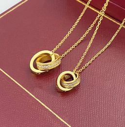 Designer 2024 Choker Womens Collier Gold Pendant Dual ring en acier inoxydable Bijoux Fashion OVAL BAGNES ENRROCK