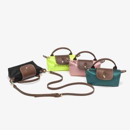 Designer Bag 2024 Longxiang Bag Mini handheld Korte handvat enkele schouder Crossbody Dumpling Zero Wallet Dames