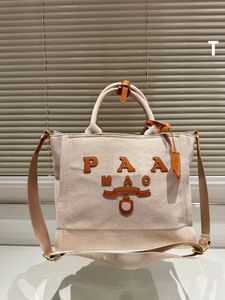 Designer tas handtas Zomer strandhandtas P Letter schoudertas Flash kantoortas Hoge kwaliteit Klassieke dames canvas tas met knop Retro luxe damestas