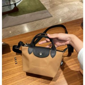 Sac de créateur Mini Nouveau Double poignée de haute qualité Sac en nylon pour femmes avec toile à vaches Casual Crossbody Sac Youth One épaule sac à main