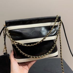 Sac de créateur mini sac poubelle rayé Une épaule bandoulière chaîne en cuir véritable Sac fourre-tout Premium Touch Restez élégant lors de vos déplacements avec notre fourre-tout tendance