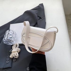 bolso de diseñador bolso de hombro bolso cruzado de moda bolso Dingdang de axila bolso pequeño de nicho de venta caliente bolso de mujer texturizado moderno y personalizado multicolor