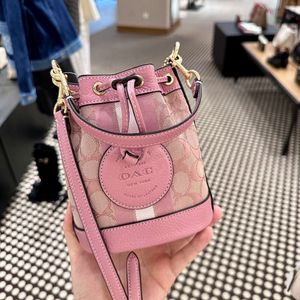 Les sacs de créateurs sont 90% de réduction moins cher 2024 printemps nouveau sac pour femme Dempsey seau eau parfumée bourgeon toile une épaule bandoulière