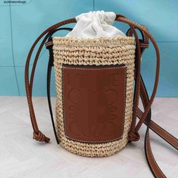 Bolsos de diseñador Natural Lafite Handheld Grass Woven Tourism Vacation One Cross Shoulder Round Bucket Bolso de mujer Casual Beach Bag styleeendibags