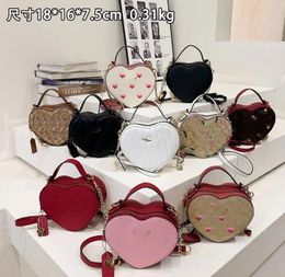 Bolsos de diseñador Bolso de mujer Bolsos de hombro clásicos Bolso de mano Totes de señora Mochila de moda Flor vieja Amor Bolso cruzado con raya de corazón lindo para mujer C204