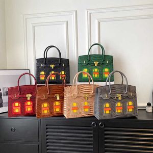 Diseñador BoKinShoulder bolsos tienda en línea 2023 nuevo bolso de mujer tendencia patrón de piedra casa pequeña grande con logotipo real