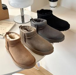 Botas de diseñador Botas de Australia Mujeres Invierno 23 Ultra Tobillo Cuero real Botines de piel de tobillo cálidos Zapato de lujo Mini botas cortas 5854