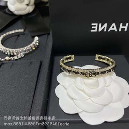 Designer armband Gold Bangle Channelism Wind Zwart Leather Rope Open Bracelet Oma Classic Fashion Double Ring Hand Hoog Grade gevoel