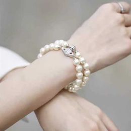 Designer merk dubbele laag Pearl Saturn Magnetic Buckle Bracelet Womens Classic Diamond