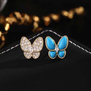 Marque de créateurs mode haut de gamme Tempérament polyvalent de niche douce niche Van Butterfly Boucles d'oreilles asymétriques Émail bleu Diamond complet pour femmes bijoux