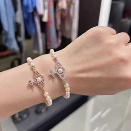 Ontwerpermerk Hoge versie Nieuwe Hollow Saturn Pearl Bracelet Womens French Classic Cross