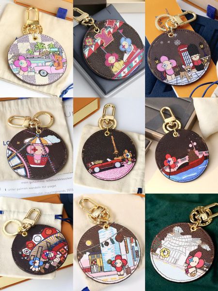 Marque de créateurs Femmes Clés Portefeuilles Tournesol Fleur Lettre Dames Ronde Porte-clés Sacs Fourre-Tout Pendentif Hommes Voiture Porte-clés Femme Sacs Pendentifs Accessoires Chien Chat Charms