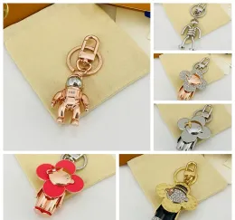 Designer Cartoon sleutelhanger luxe dames heren sleutelhanger hoge kwaliteit auto sleutelhanger minnaar goud zwart metaal kleine sieraden charme tas hanger sieraden goed cadeau 2311175D