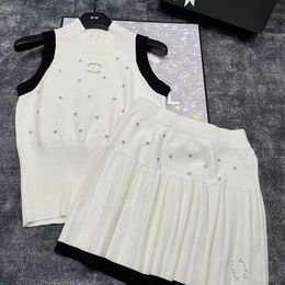 Diseñador Traje informal Skirt de dos piezas Carta de moda de dos piezas Estampado Estampado de manga corta Top Traje