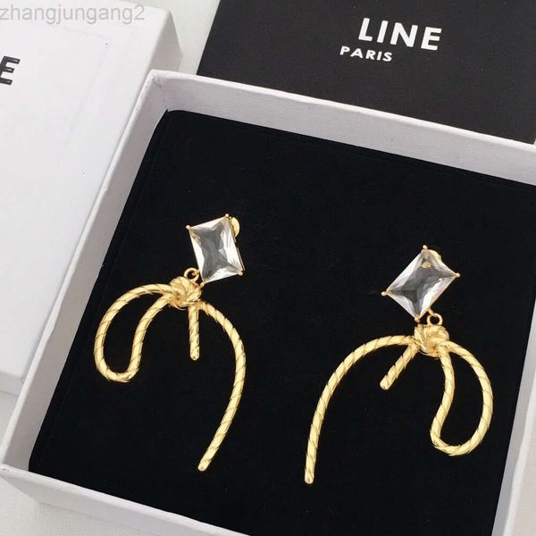 Créateur Celins Jewelry Saijia 22's Nouvelles boucles d'oreilles à ruban papillon géométrique pour femmes avec un sens du tempérament haut de gamme Boucles d'oreilles en cuivre plaqué or et diamant