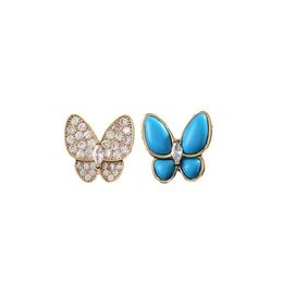 Designer charme high -end mode veelzijdig temperament zachte nichebusje vlinder oorbellen asymmetrisch blauw email volledige diamant voor vrouwen sieraden