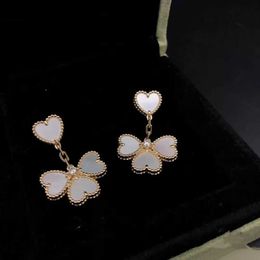 Boucles d'oreilles Van Van Love 925 argent sterling plaqué avec des bijoux en forme de coeur Fritillaria blanc 18 carats