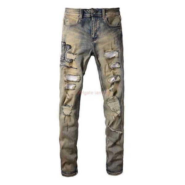 Ropa de diseñador Amires Jeans Pantalones de mezclilla Amies Tide Brand High Street Yellow Mud Dirty Wash Water Hecho de Old Cobra Bordado Agujero Slim Fit Pies pequeños Pantalones de mezclilla Bo