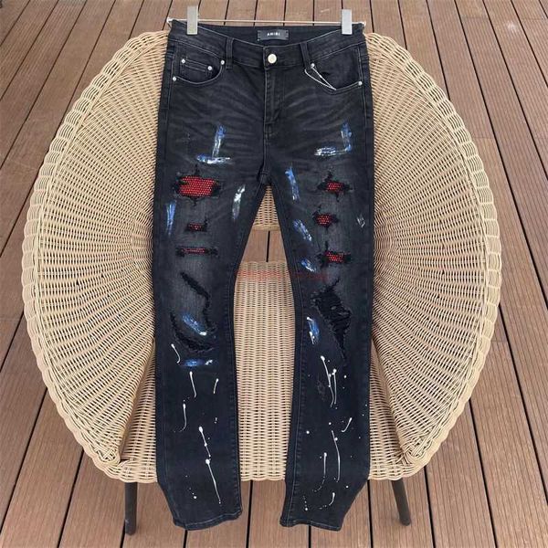 Vêtements de créateurs Amires Jeans Pantalons en denim Amies Peinture noire Graffiti incrusté de diamants rouges Stretch Jeans High Street Torn Hommes Femmes Pantalons longs Rippe en détresse