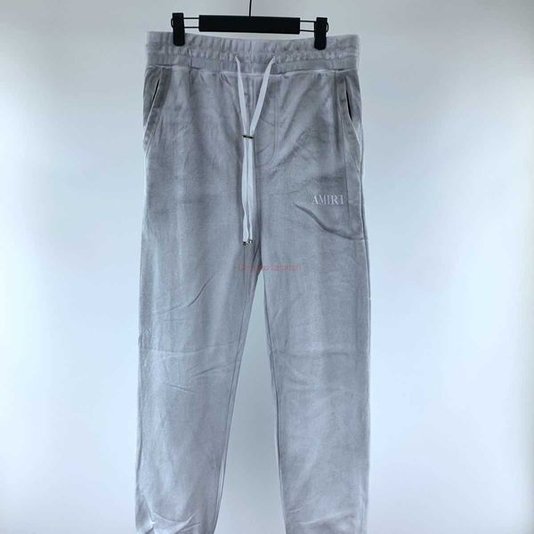 Ropa de diseñador Pantalón Amires 2023 Nuevo Amies Bolsillo con cremallera Cordón Tobillo Versátil con impresión de letras propias Gris claro Guardias largos Moda de lujo Pantalón casual