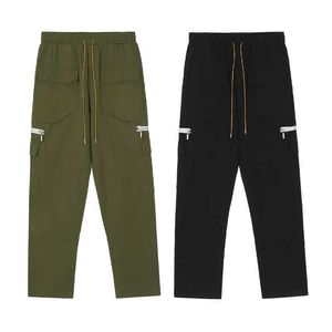 Ropa de diseñador Pantalón casual Rhude Pantalones cargo de moda Pantalones de motocicleta con múltiples bolsillos Pantalones casuales versátiles para hombres y mujeres Pantalones con hebilla suelta para la venta