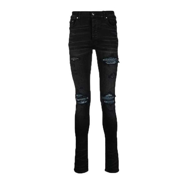 Ropa de diseñador Pantalones de mezclilla Amiiri Trendy Brand Old Black Rasgado Hole Patchwork Leather High Street Slp Slim Fitting Small Leg Jeans Pantalones largos para hombres
