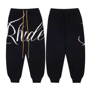 Ropa de diseñador Pantalón Rhude Primavera Nuevos hombres Pantalones casuales para mujer Jacquard Carta Pantalones de punto INS High Street Trend Brand Leggings Streetwear Jogger Pantalones