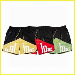 Vêtements de marque Rhude Shorts American High Street Lettre à la mode Patchwork bicolore Cordon de serrage Pantalon de plage à cinq points Couples Joggers Vêtements de sport