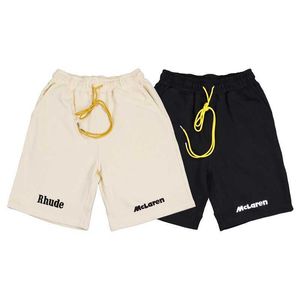 Ropa de diseñador corta casual Rhude x Mclaren Marca de tendencia Pantalones cortos Verano Alfabeto Bordado Hombres Mujeres Deportes sueltos Capris Parejas Joggers Ropa deportiva