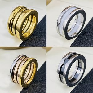 Designer Cluster 18K Gold Spring Rings Brand Ceramic Ring Women Hoge kwaliteit Roestvrij staal Wit Black Sieraden Zilvergoud Nooit vervagen Ring Classic Premium Jewelry