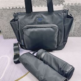 Bolsa de pañales de diseñador, bolso cruzado de hombro clásico de gran capacidad, bolsos de bebé de moda, bolsos prácticos para exteriores CSD2403142