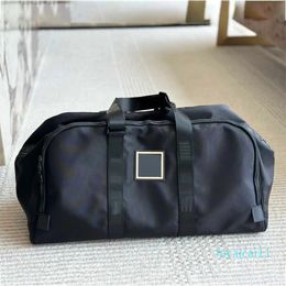 Bolsa de lona de diseñador Hombres Mujeres Fashion Designer Travel Bag Bag Bag Capacidad Metal Costilla Parte de cuero Crossbody Bolsas de viaje
