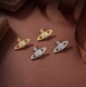 Boucles d'oreilles de créateurs Saturn Pearl Diamond Stud Luxe pour femmes Bijoux de mode Planète Boucle d'oreille en or 18 carats Boucle d'oreille en métal Perle Homme Conception de flux de marée
