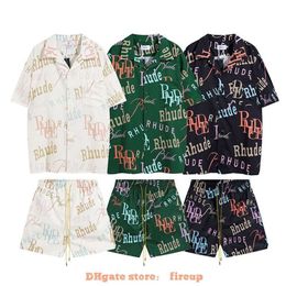 Diseñador Ropa de moda Camisetas para hombre Camiseta Rhude Carta colorida Aop Camisa de manga corta High Street Br Suelto Verano Casual Pantalones cortos deportivos Conjunto Ins